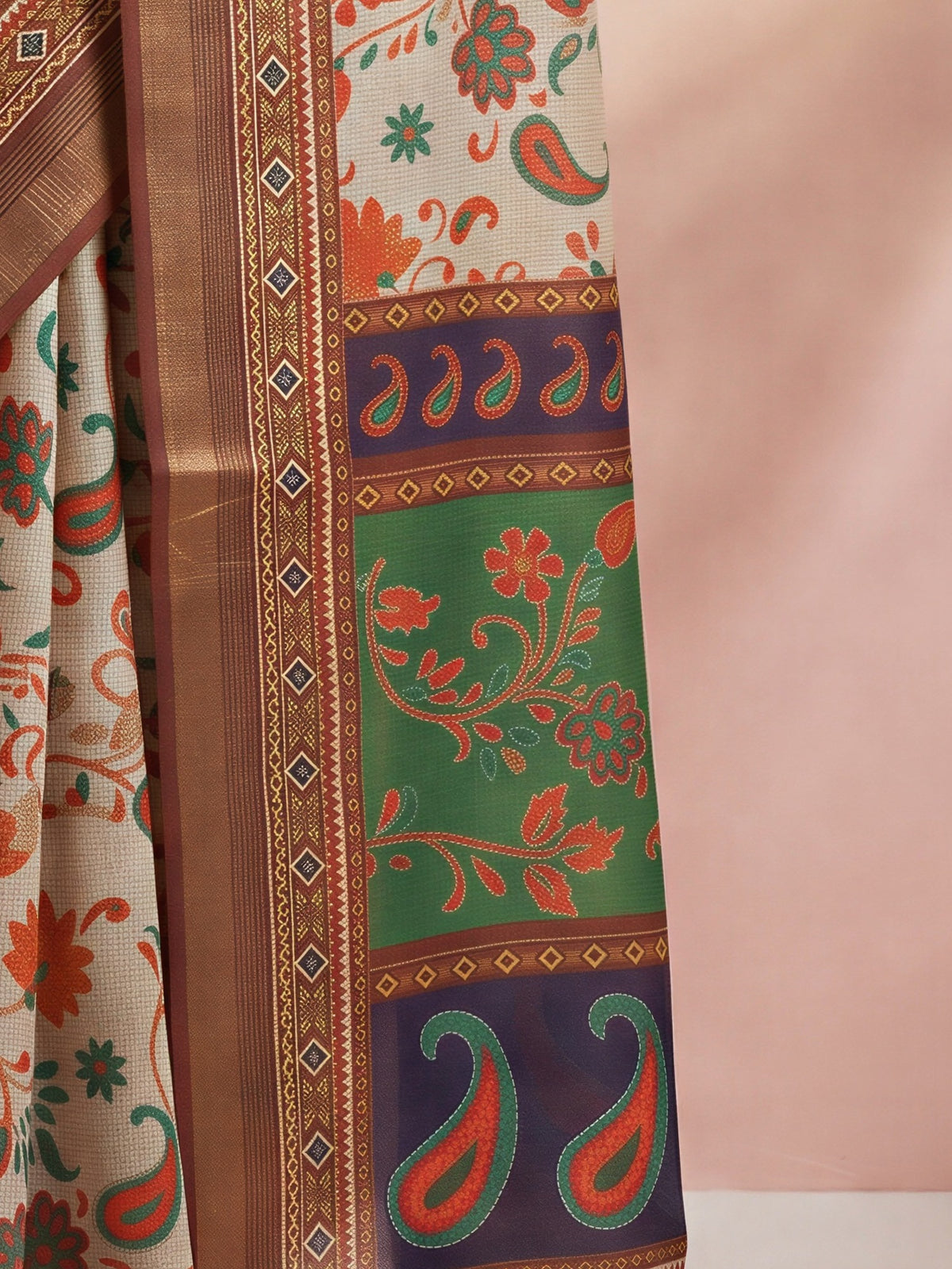 Pallu detail of light brown cotton linen saree showing traditional indian motif work and zari border