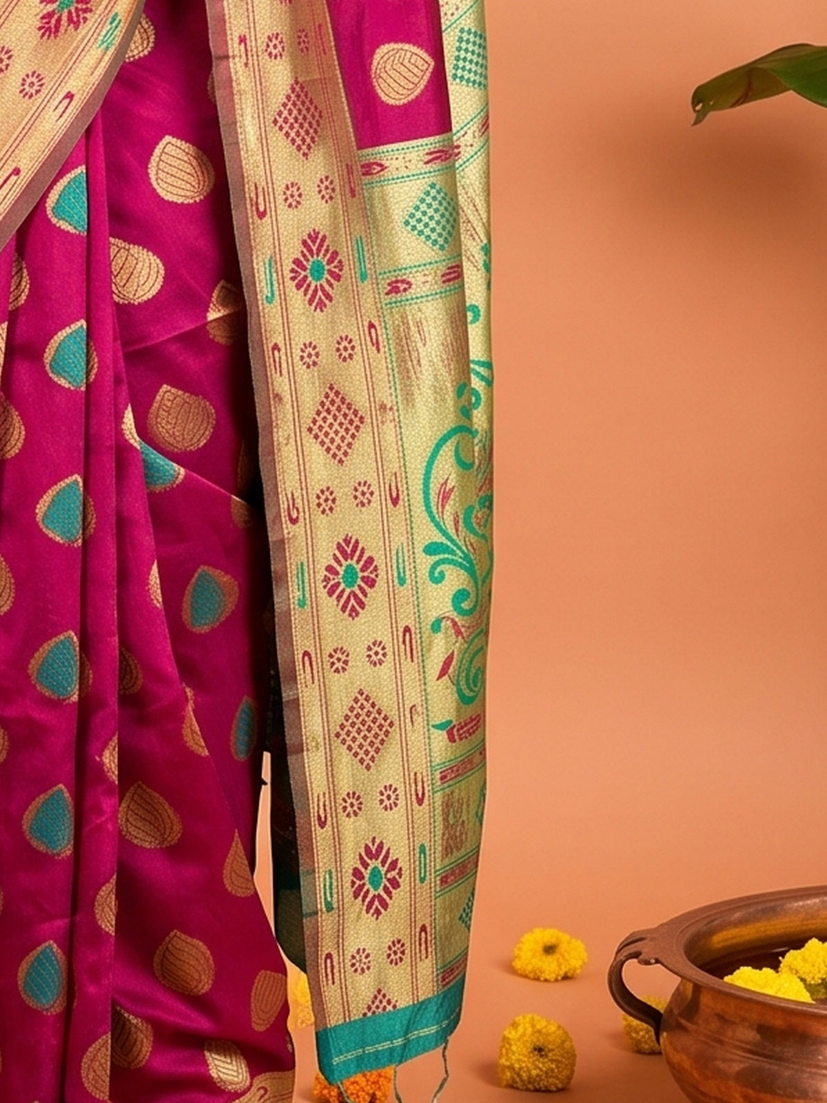 Pallu detail of pink silk blend saree showing zari butta (metallic motif) work and zari border