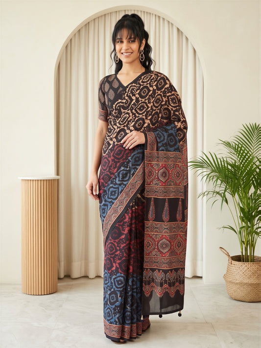 Woman wearing beige silk blend saree with traditional indian motif work and black blouse
