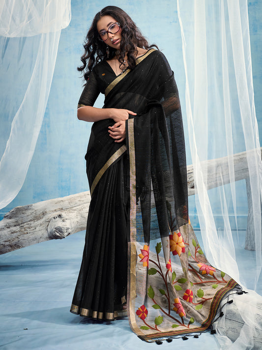 Woman wearing black muga silk saree with clean solid-tone finish and black blouse