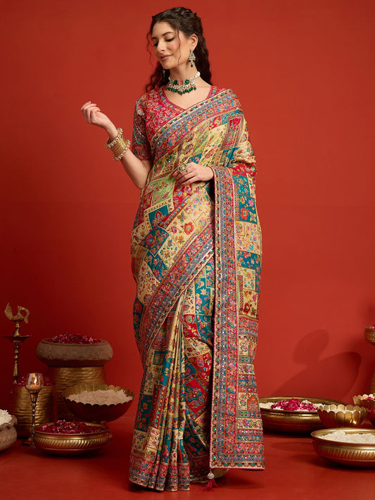 Woman wearing cream silk blend saree with traditional indian motif work and pink blouse