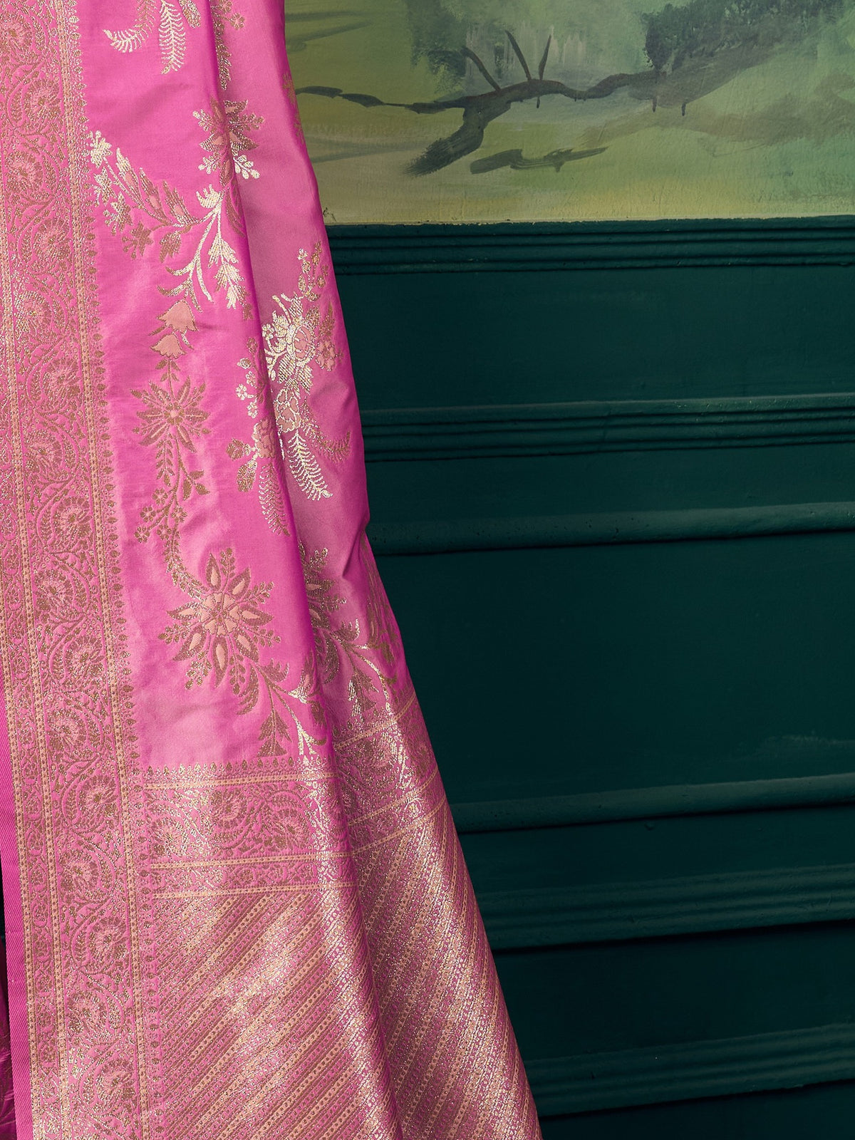 Pallu detail of pink banarasi silk saree showing woven motif design and zari border
