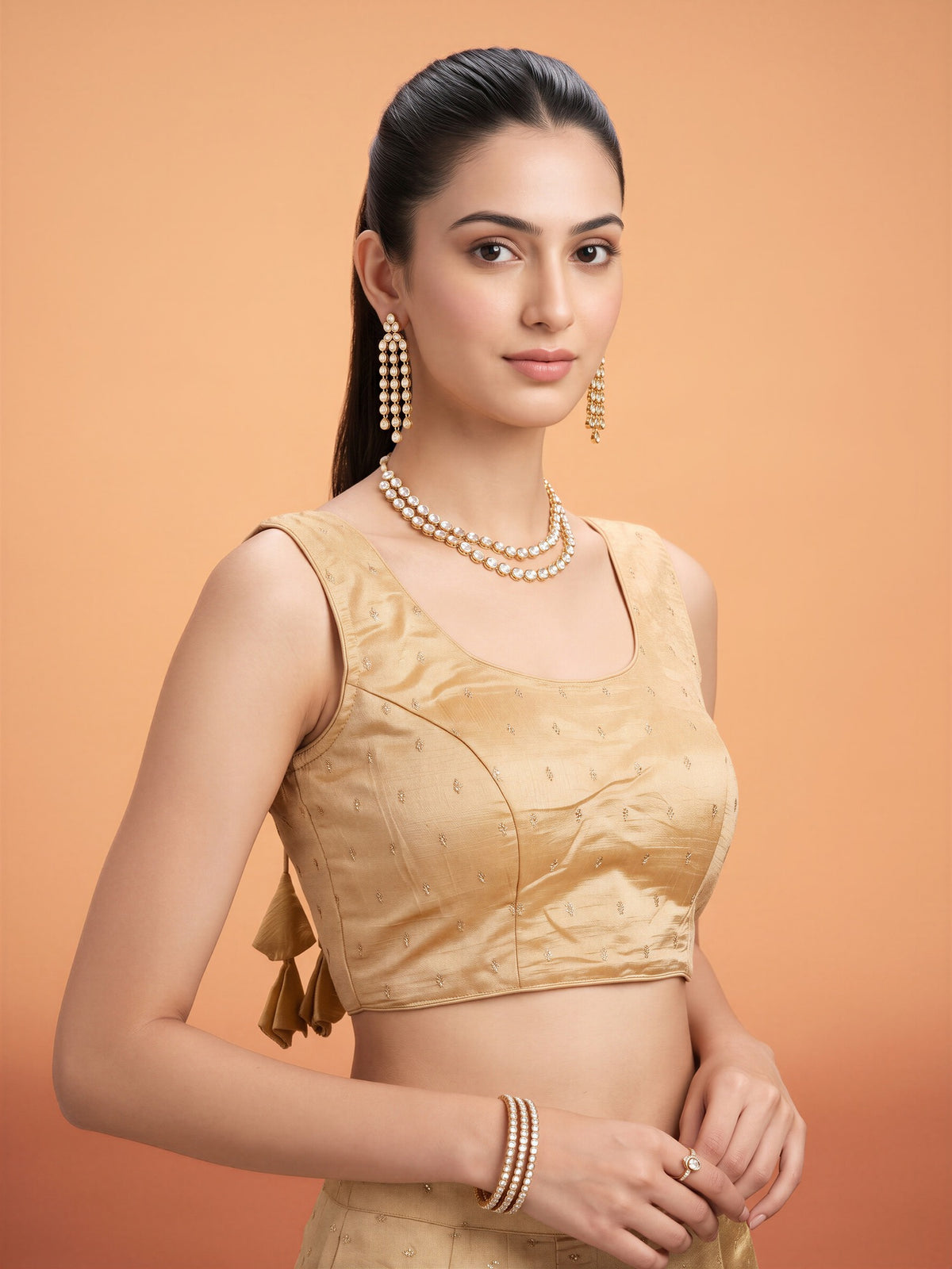 Cream sequin embellished silk blend sleeveless readymade saree blouse with round neck