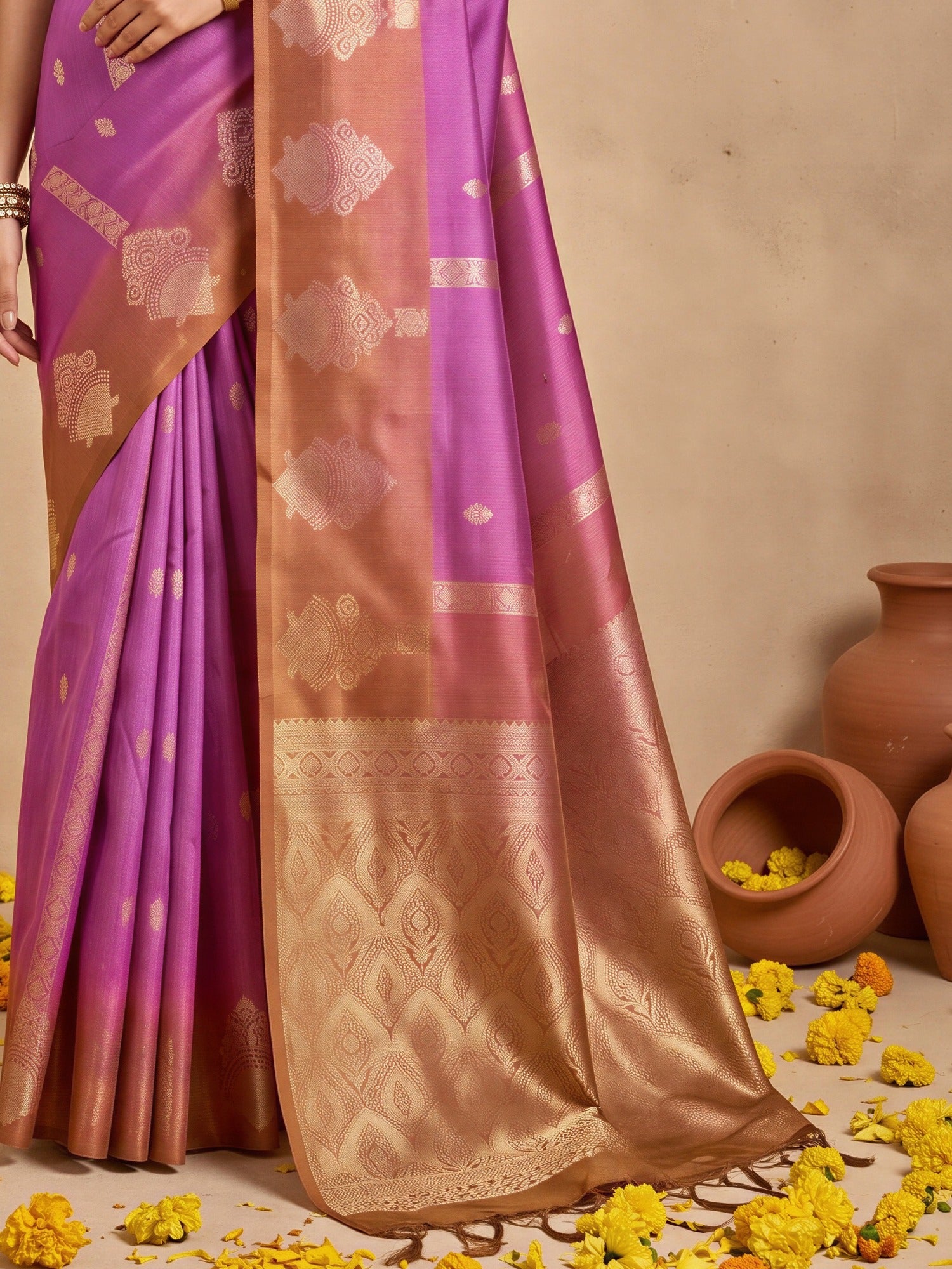 Pallu detail of purple cotton blend saree showing ornamented surface design and solid border