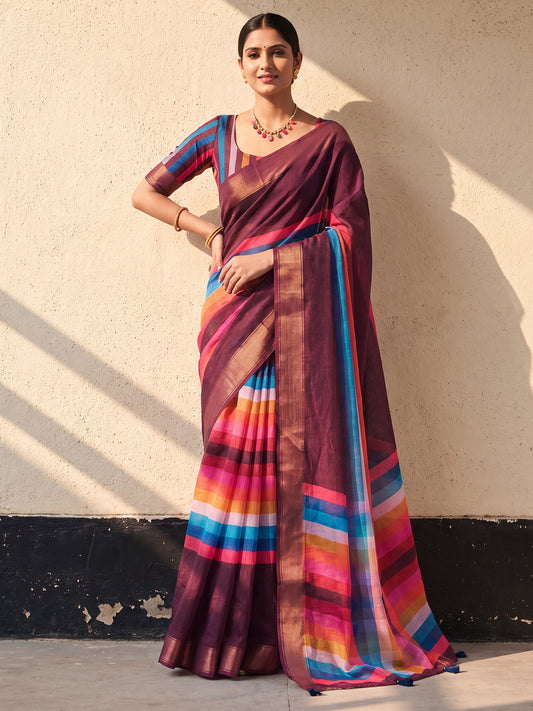 Woman wearing dark brown linen saree with colorblocked design and multicolored blouse