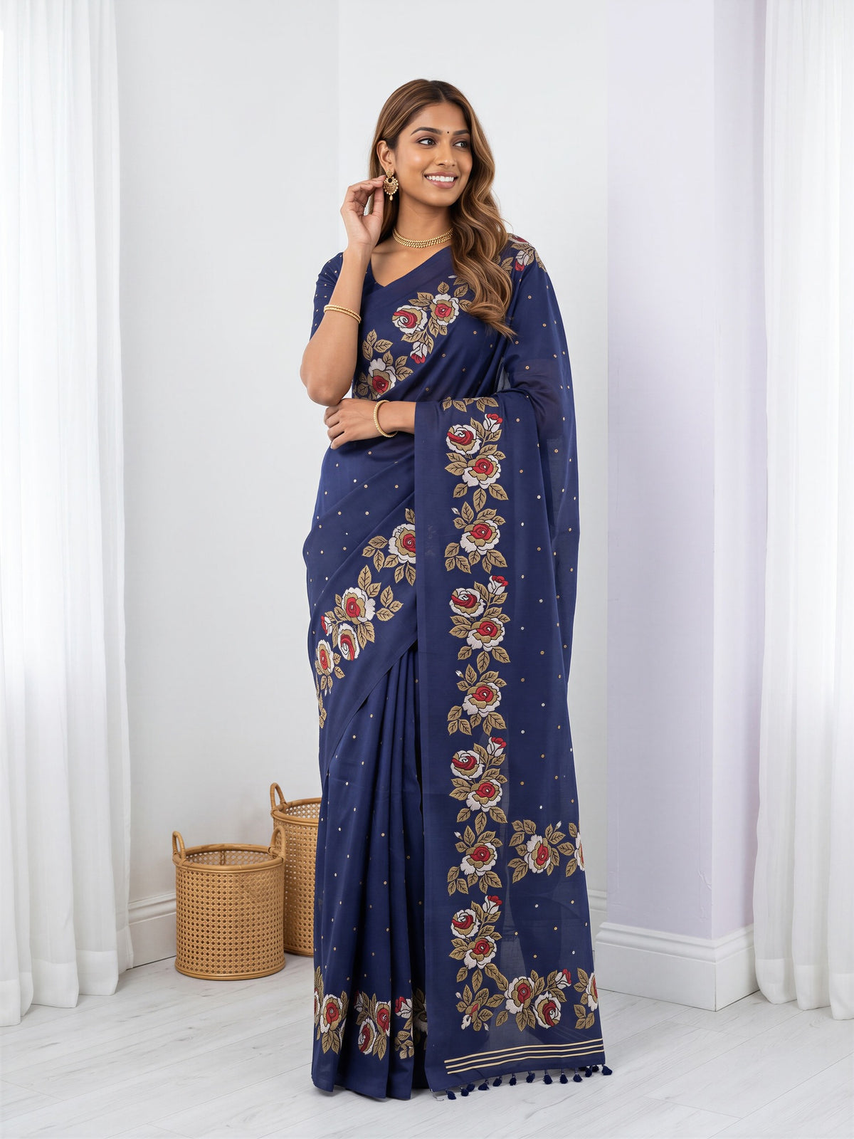 Woman wearing navy blue dola silk saree with zari butta (metallic motif) work and navy blue blouse