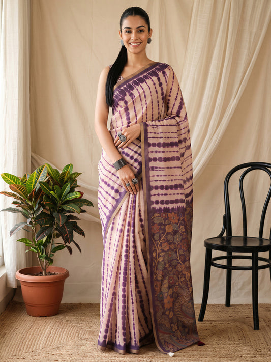 Woman wearing pink cotton blend saree with tie-and-dye resist pattern and pink blouse