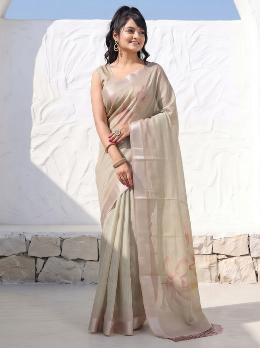 Woman wearing metallic cotton silk saree with all-over floral design and metallic blouse