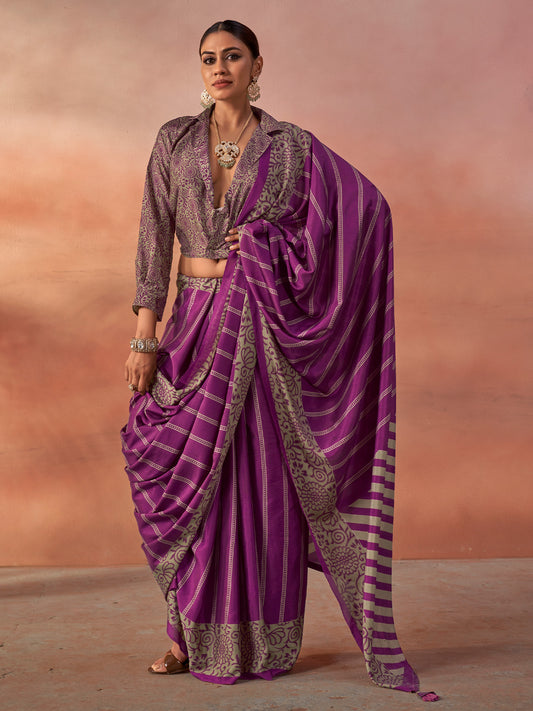 Woman wearing magenta silk blend saree with traditional indian motif work and magenta blouse