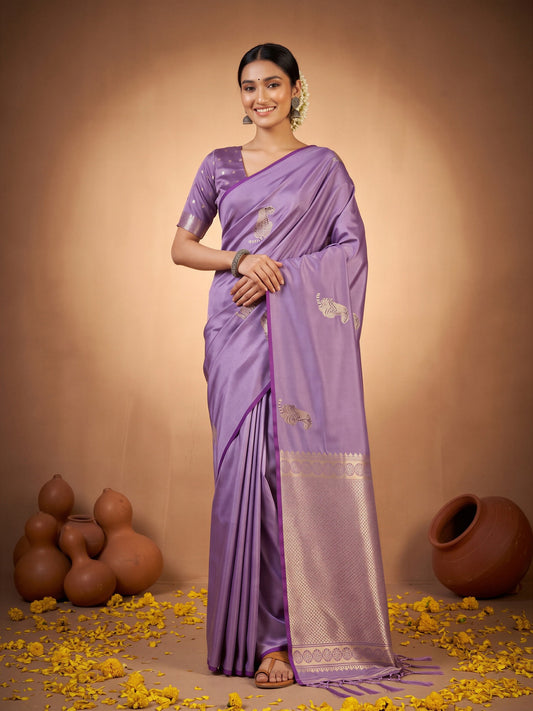 Woman wearing lavender satin silk saree with animal-print design and lavender blouse