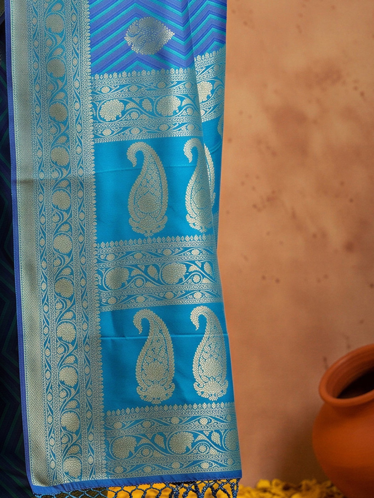 Pallu detail of navy blue silk blend saree showing geometric pattern design and zari border