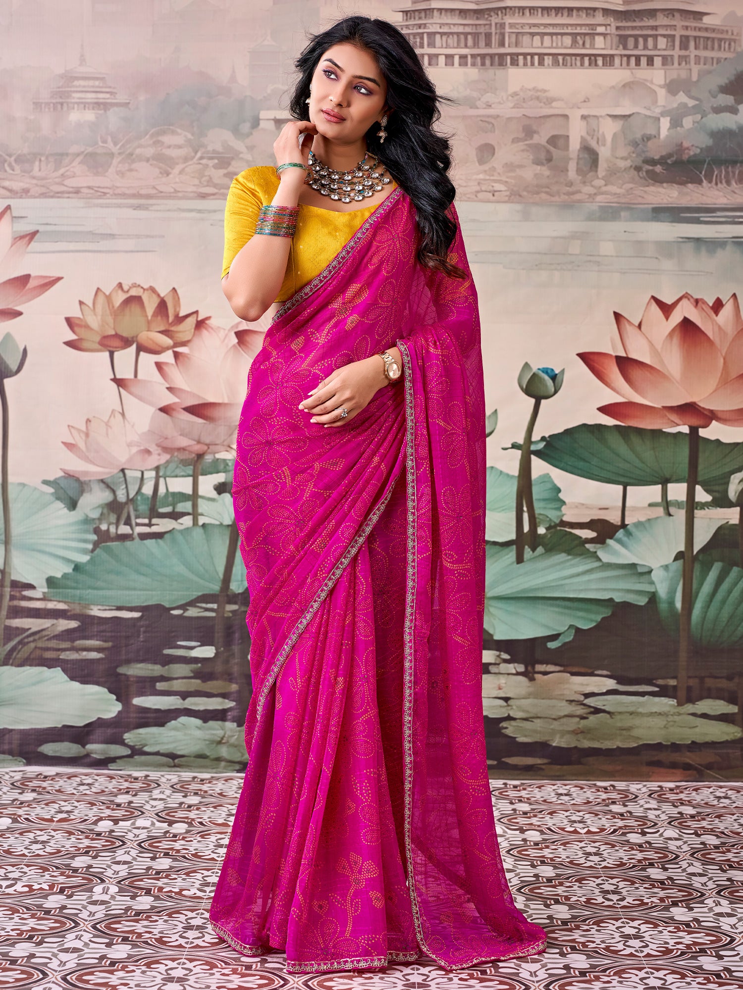 Woman wearing pink georgette saree with bandhani tie-dye dot work and mustard blouse
