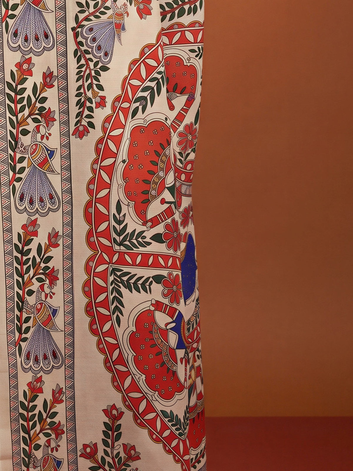 Pallu detail of off white chinnon saree showing kalamkari narrative motif work and printed border