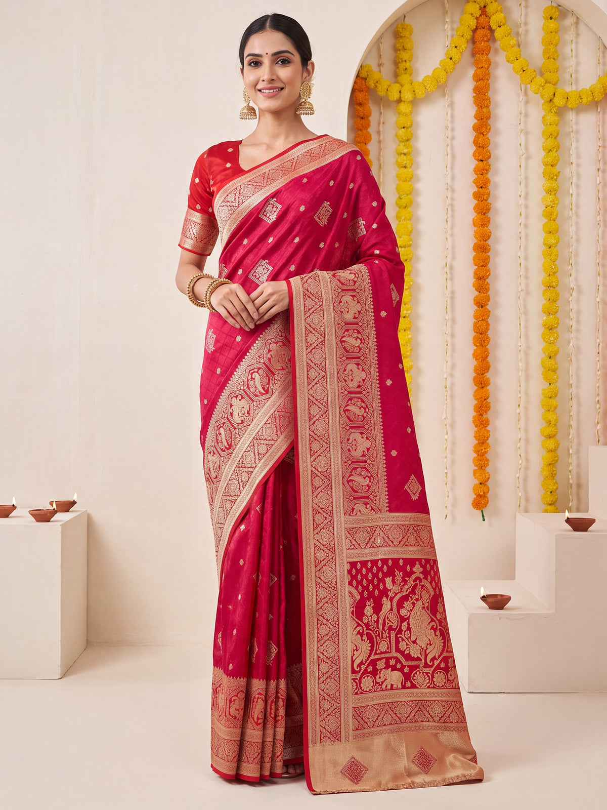 Woman wearing pink satin silk saree with zari butta (metallic motif) work and red blouse