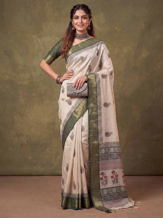 Woman wearing green cotton silk saree with batik wax-resist design and green blouse