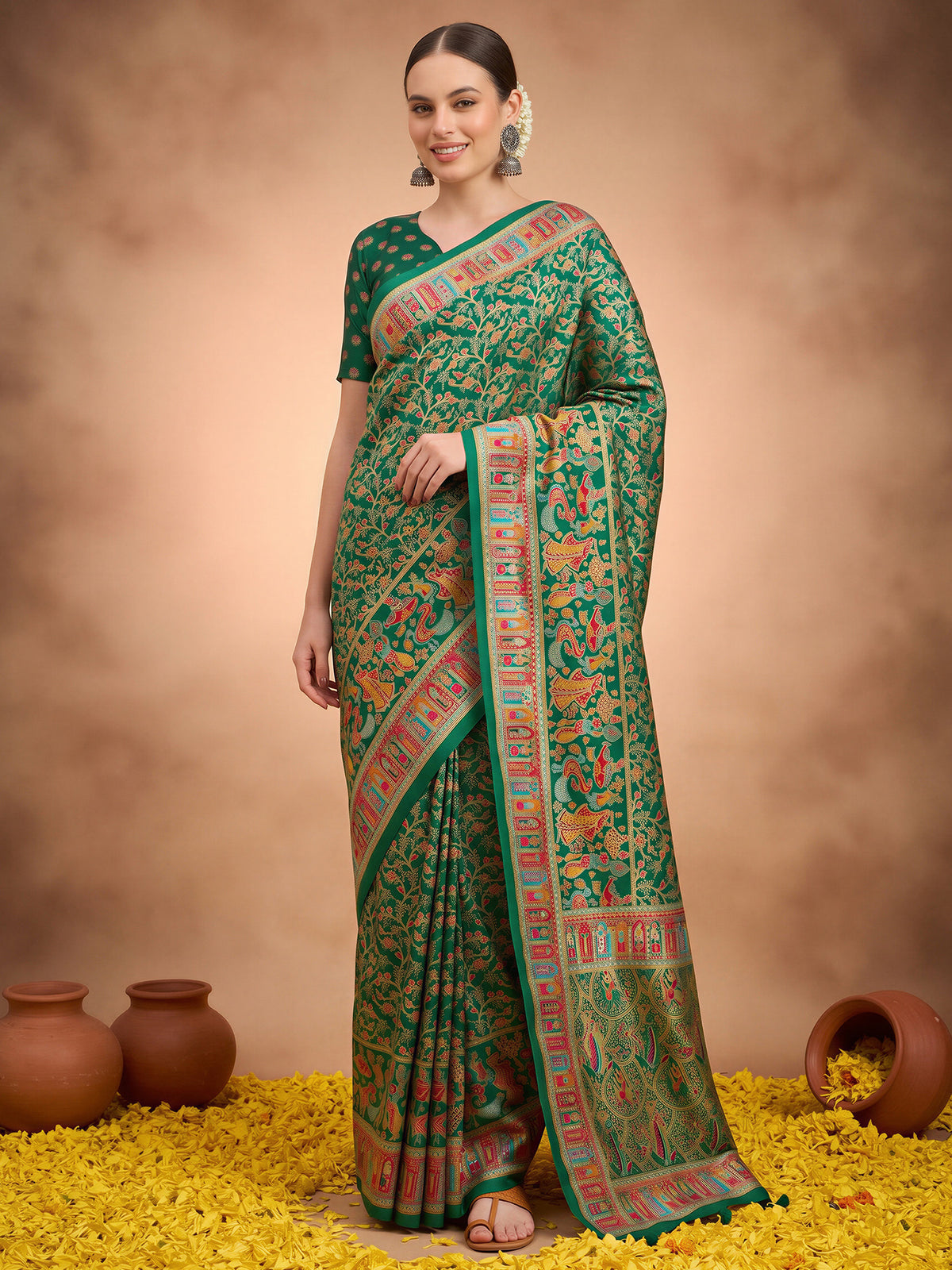 Woman wearing dark green silk blend saree with metallic foil print work and dark green blouse