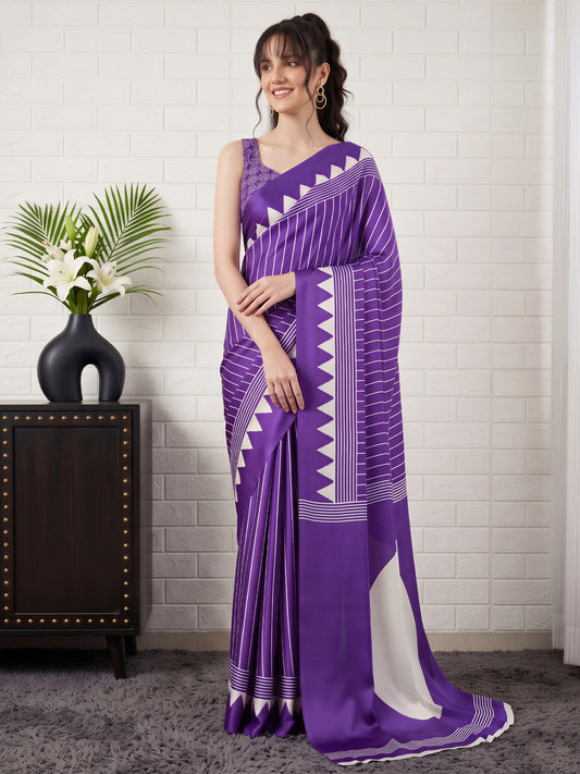 Woman wearing purple satin saree with striped pattern design and purple blouse