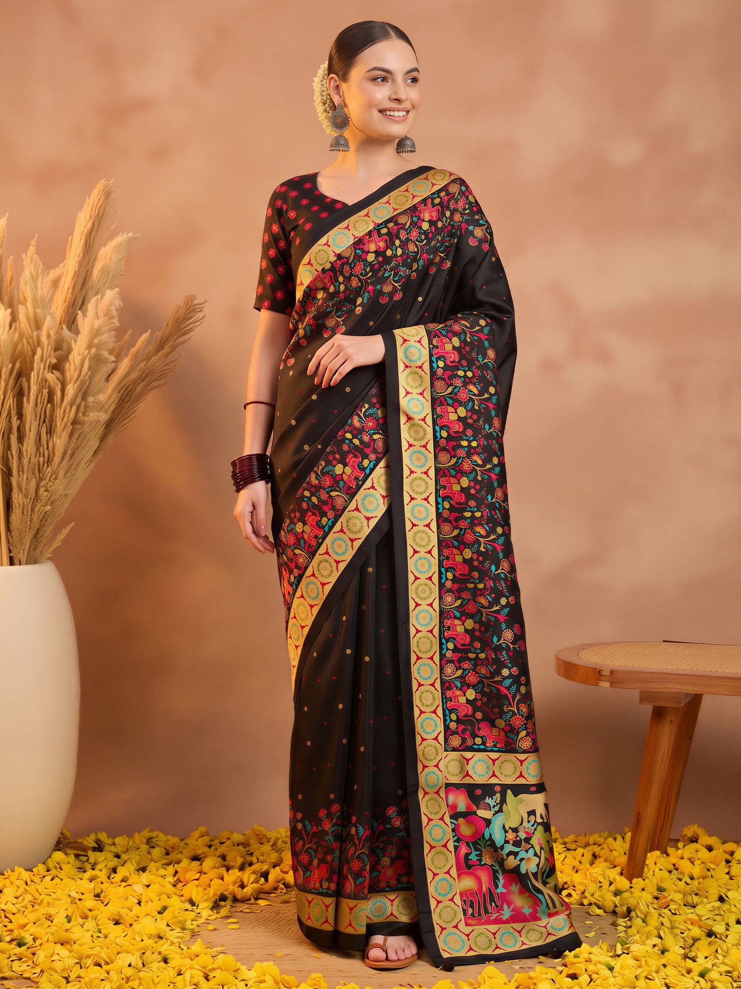 Woman wearing cream silk blend saree with metallic foil print work and black blouse