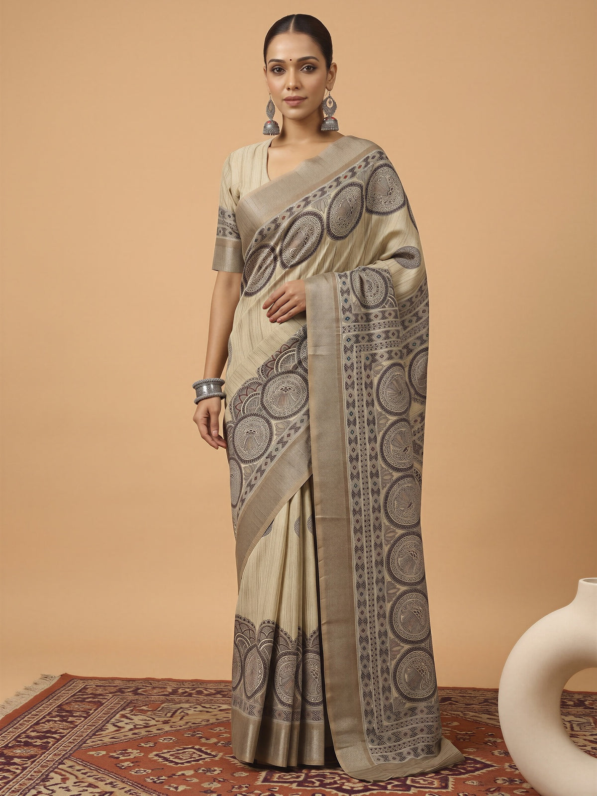 Woman wearing beige satin silk saree with hand block-printed motifs and beige blouse