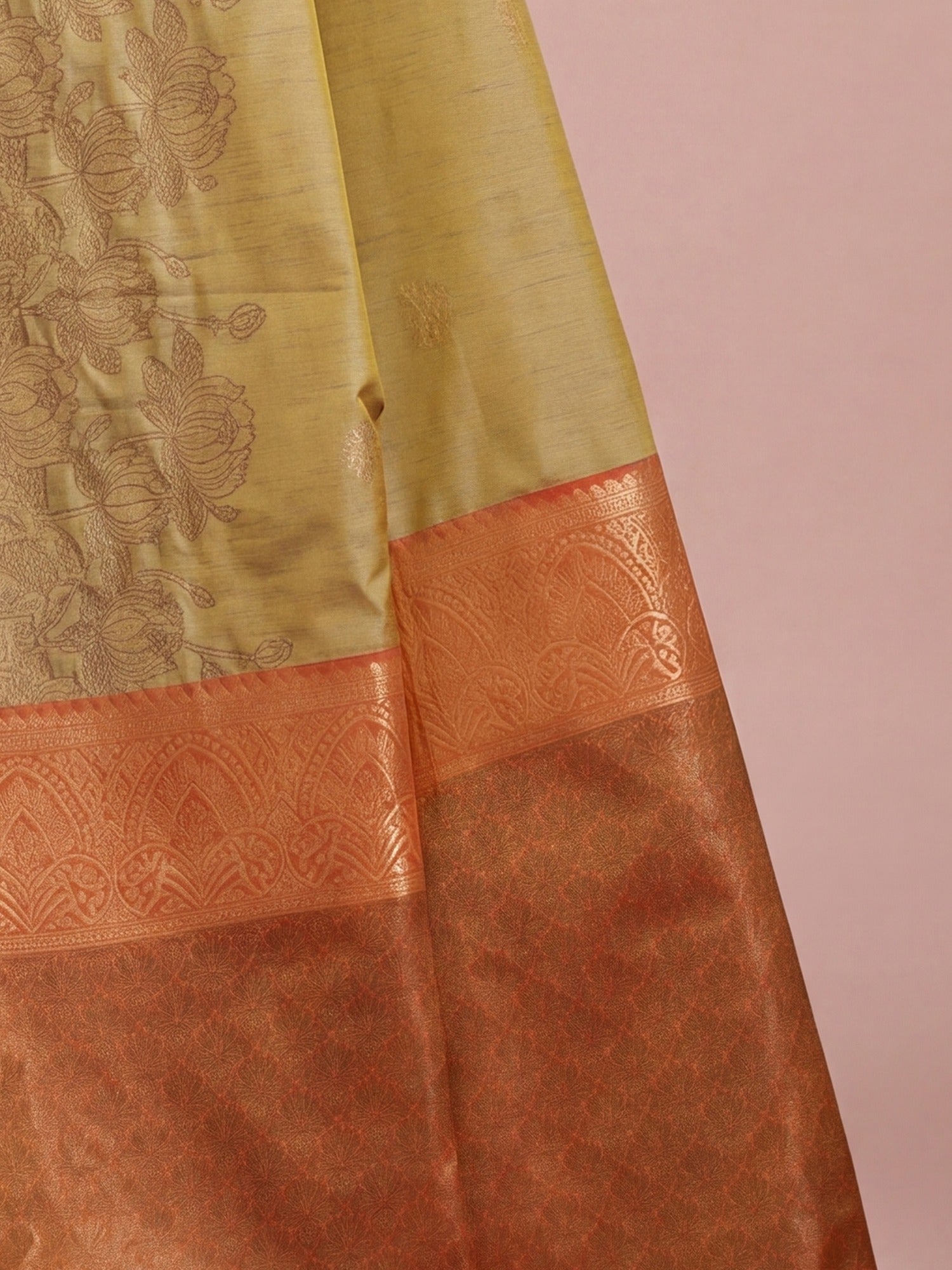 Pallu detail of mustard tussar silk saree showing traditional indian motif work and zari border
