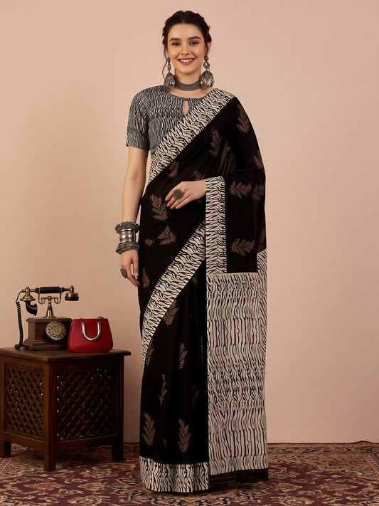 Woman wearing black bhagalpuri silk saree with hand block-printed motifs and black blouse