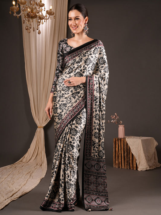Woman wearing cream satin saree with ajrak block-print motif work and black blouse