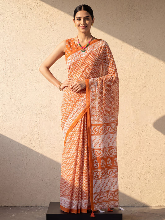 Woman wearing orange cotton saree with bagru hand block-print work and orange blouse