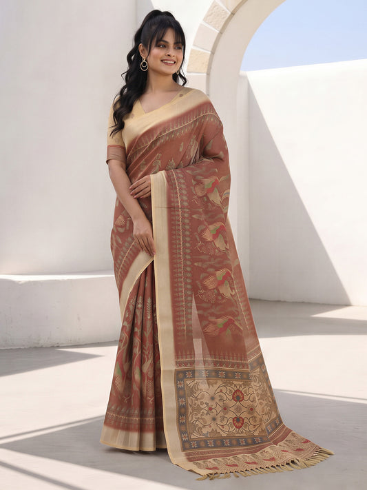 Woman wearing light brown cotton silk saree with kalamkari narrative motif work and cream blouse