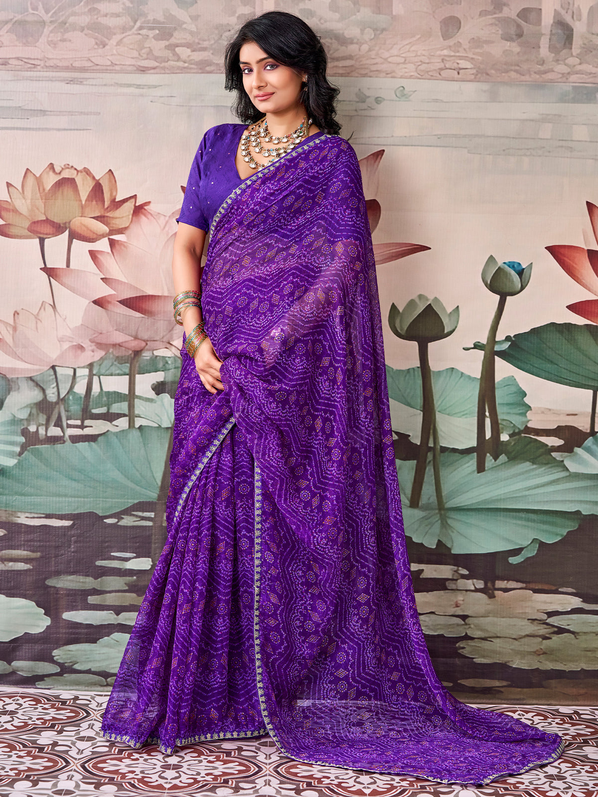 Woman wearing purple georgette saree with leheriya design and purple blouse