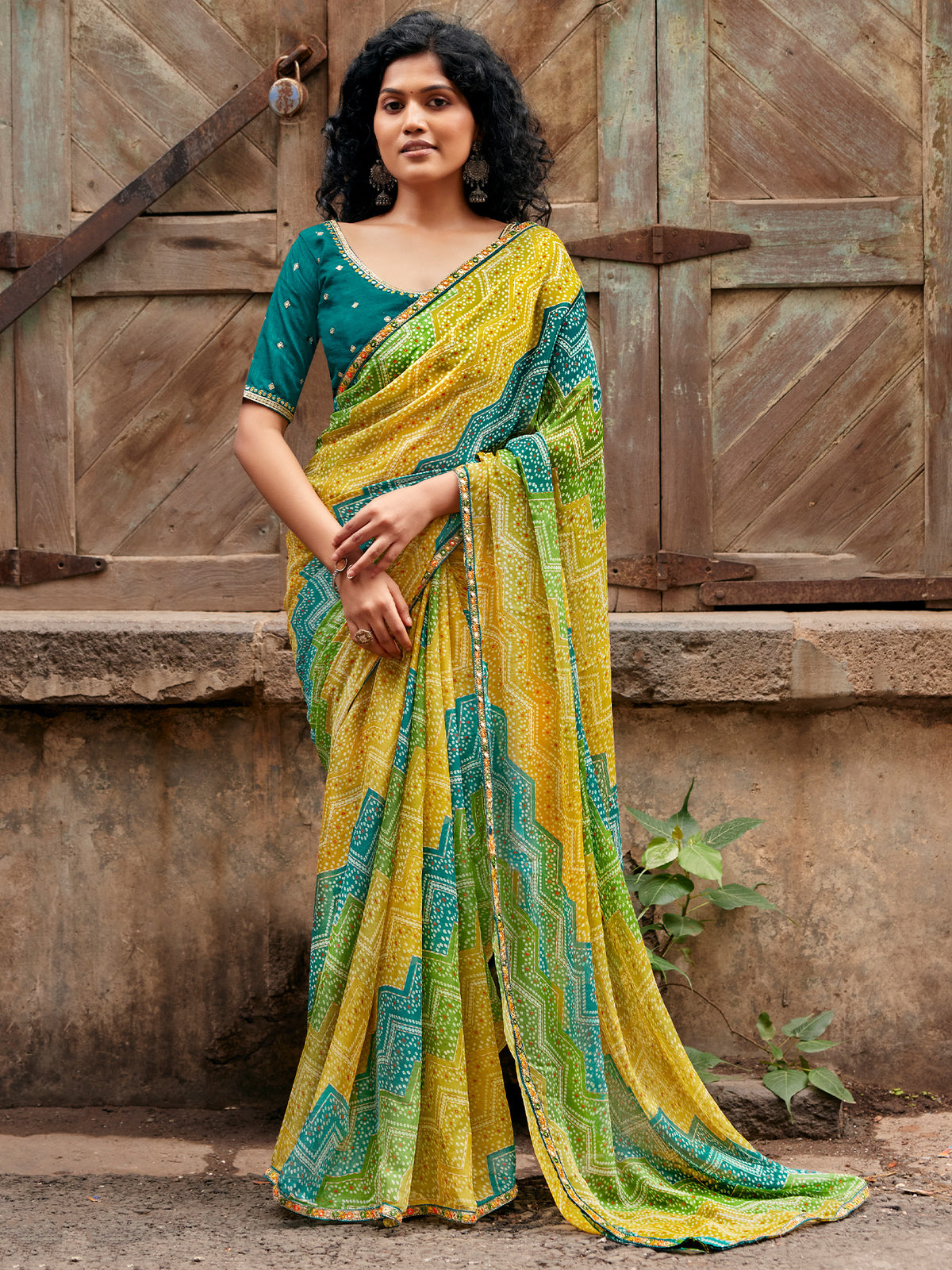 Yellow leheriya georgette saree with teal green blouse piece