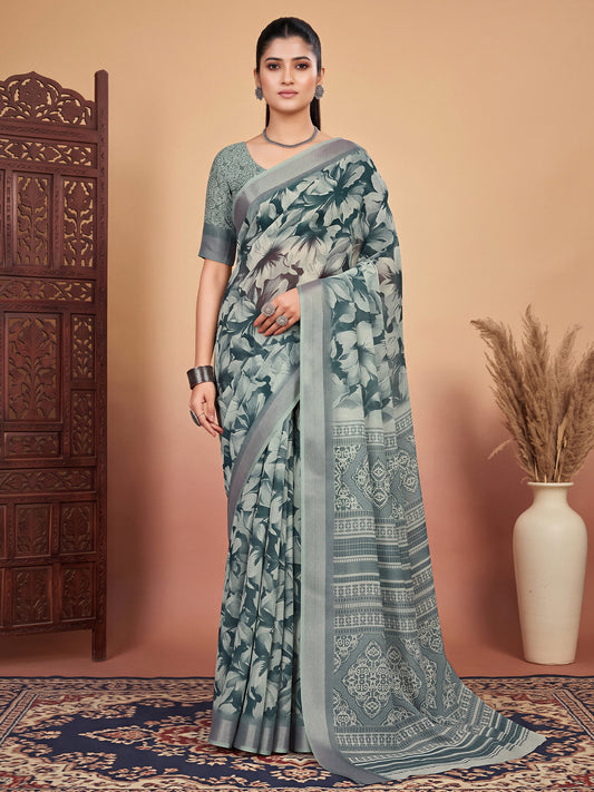 Woman wearing green cotton linen saree with traditional indian motif work and green blouse