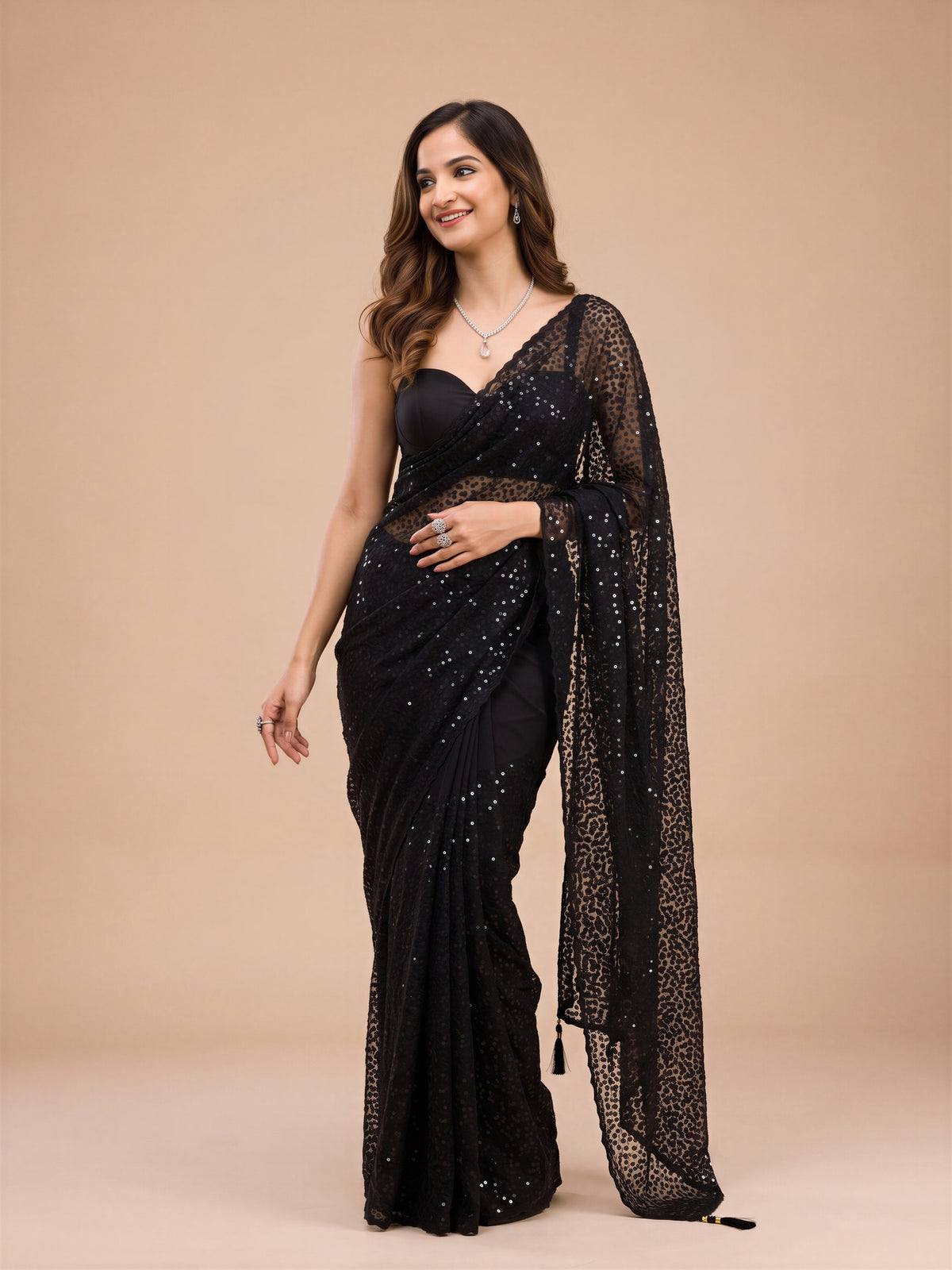 Woman wearing purple net saree with embroidered motif work and purple blouse