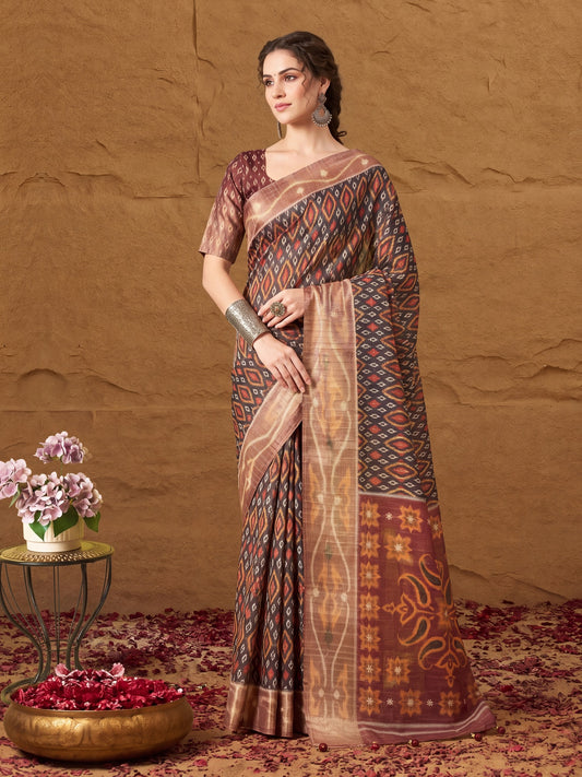 Woman wearing black silk blend saree with ikat resist-dyed pattern and brown blouse