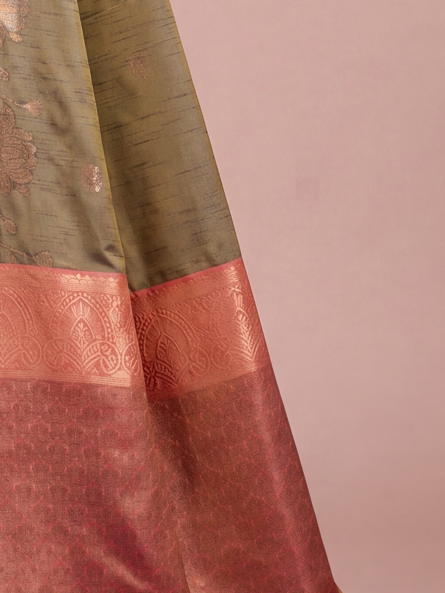 Pallu detail of brown tussar silk saree showing traditional indian motif work and zari border