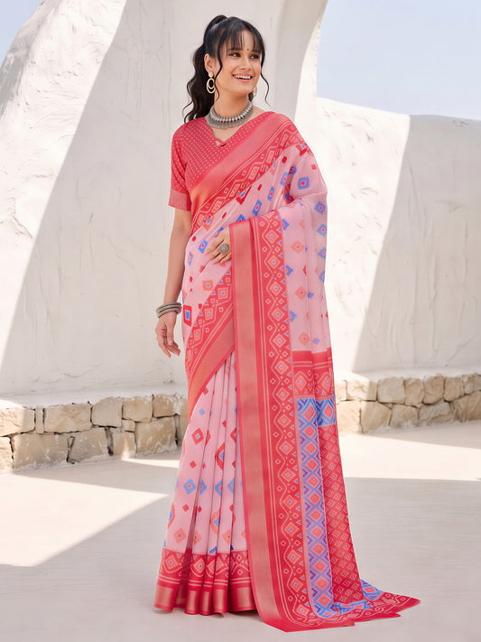 Woman wearing pink cotton linen saree with traditional indian motif work and pink blouse
