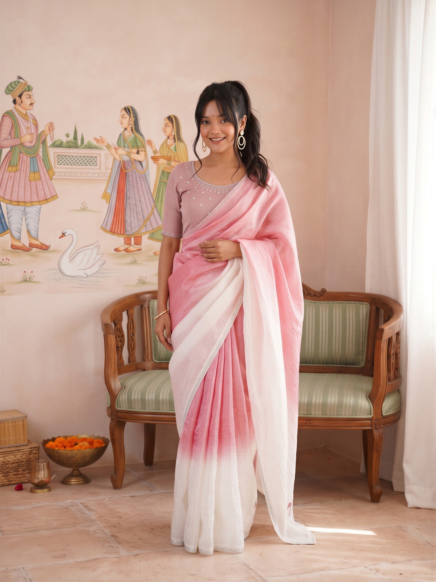 Woman wearing pink paper silk saree with ombre graded colour work and pink blouse