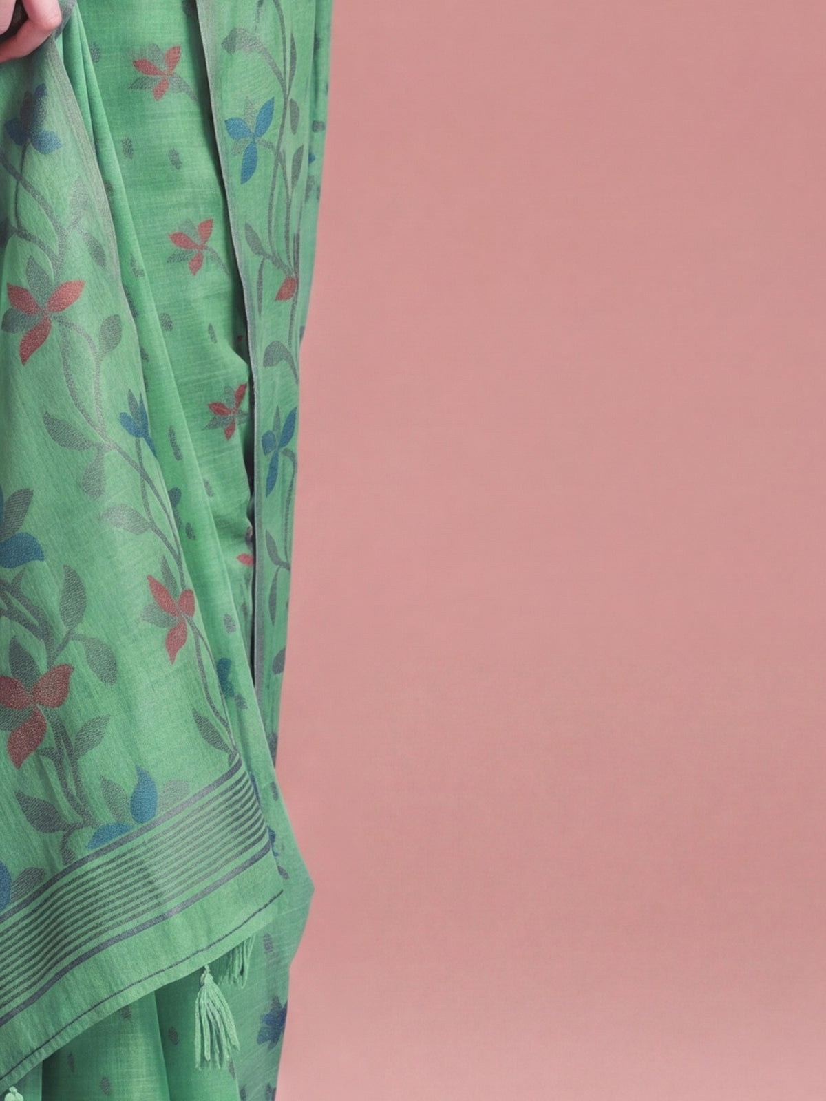 Pallu detail of light green linen saree showing all-over floral design and woven design border