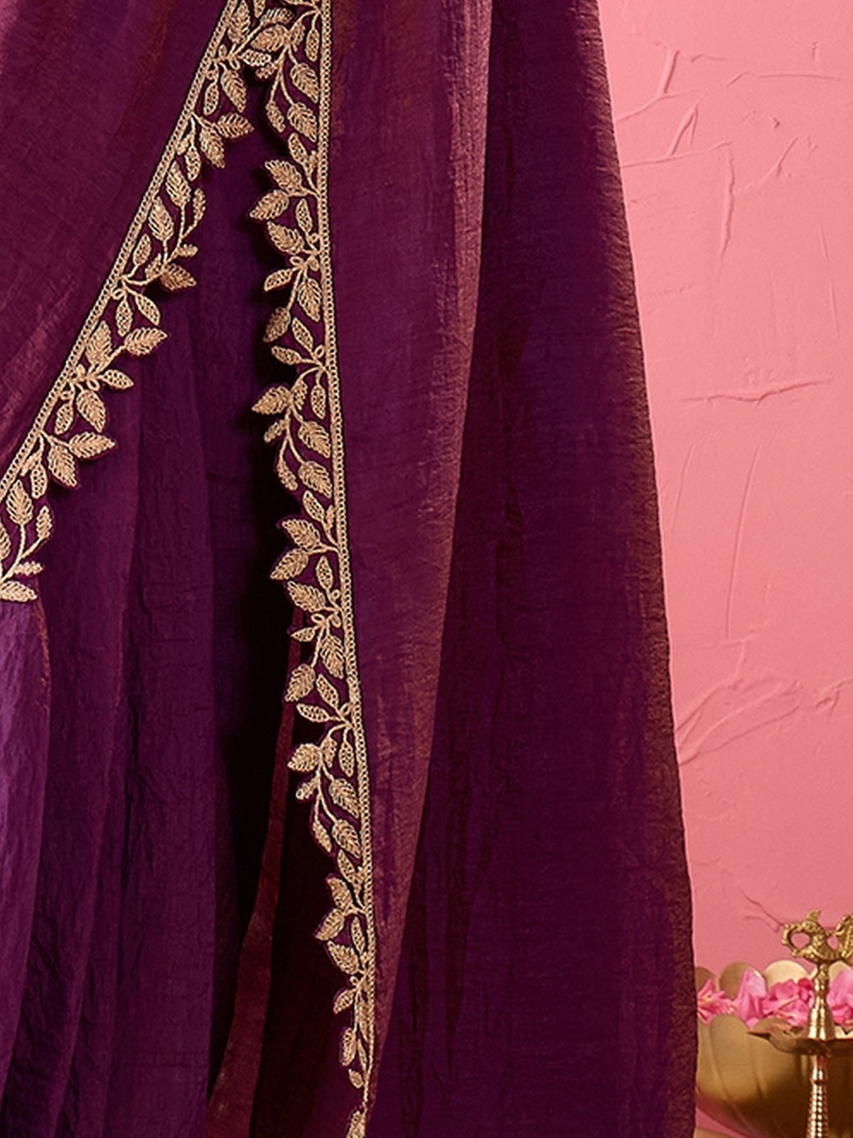 Pallu detail of purple silk saree showing ornamented surface design and zari border