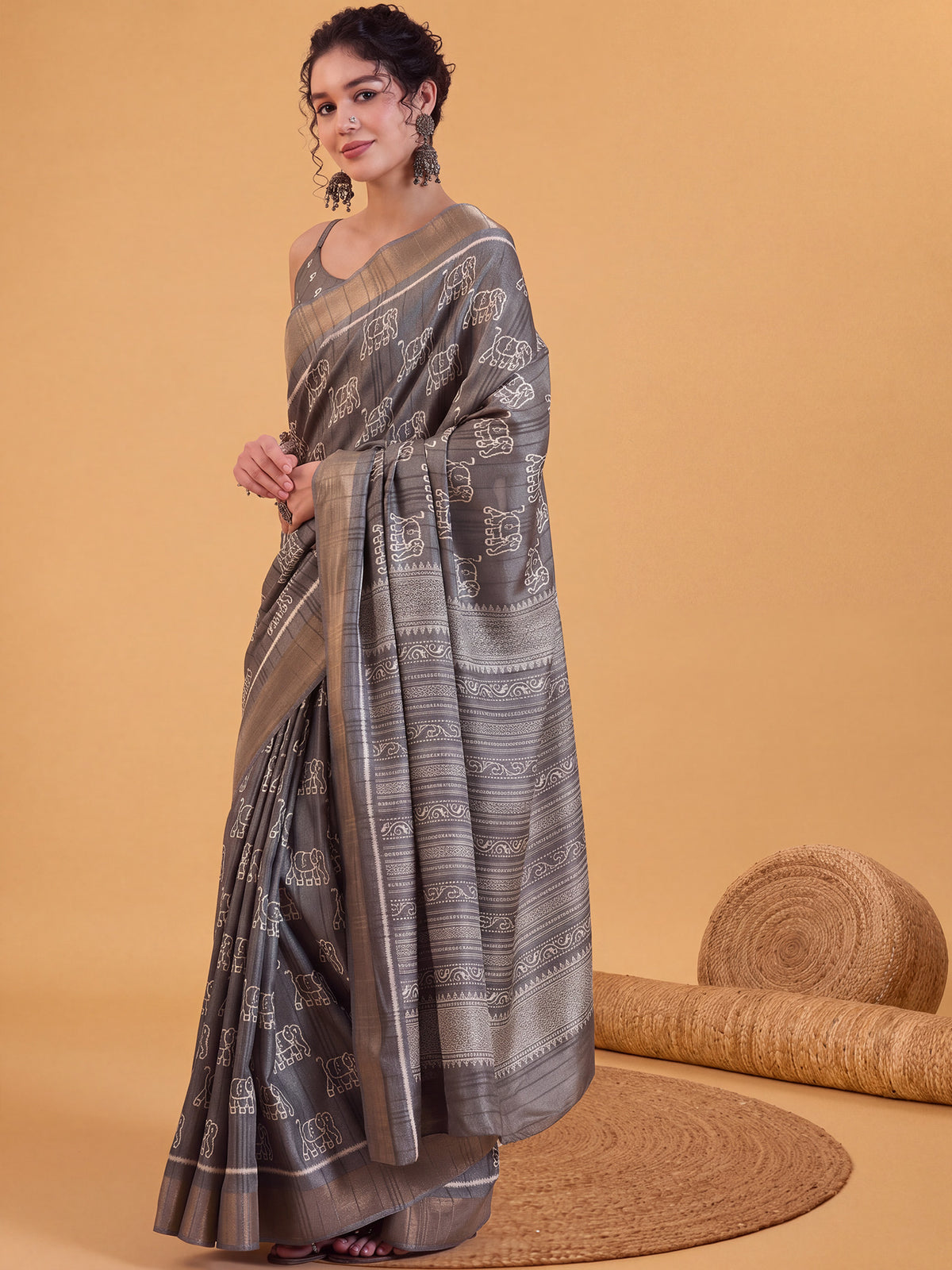 Woman wearing grey silk blend saree with hand block-printed motifs and grey blouse