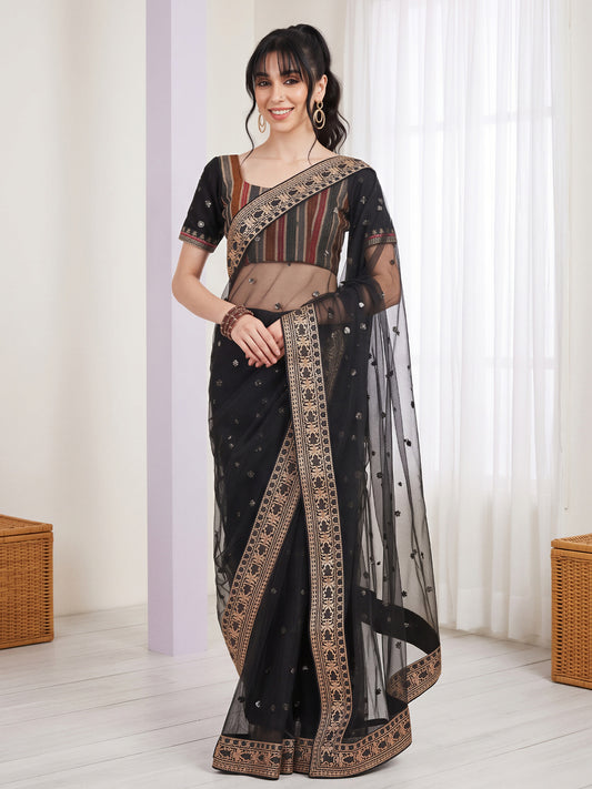 Woman wearing black net saree with embroidered motif work and black blouse