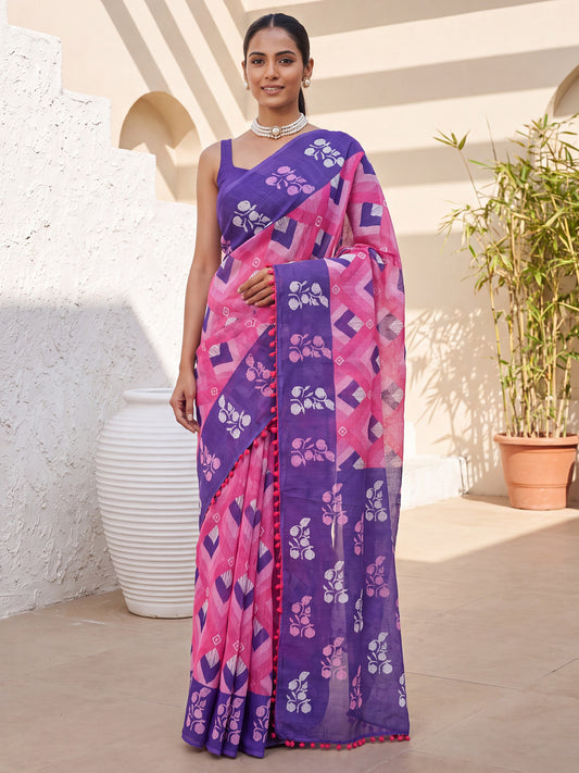 Woman wearing pink cotton saree with chevron zigzag pattern and purple blouse