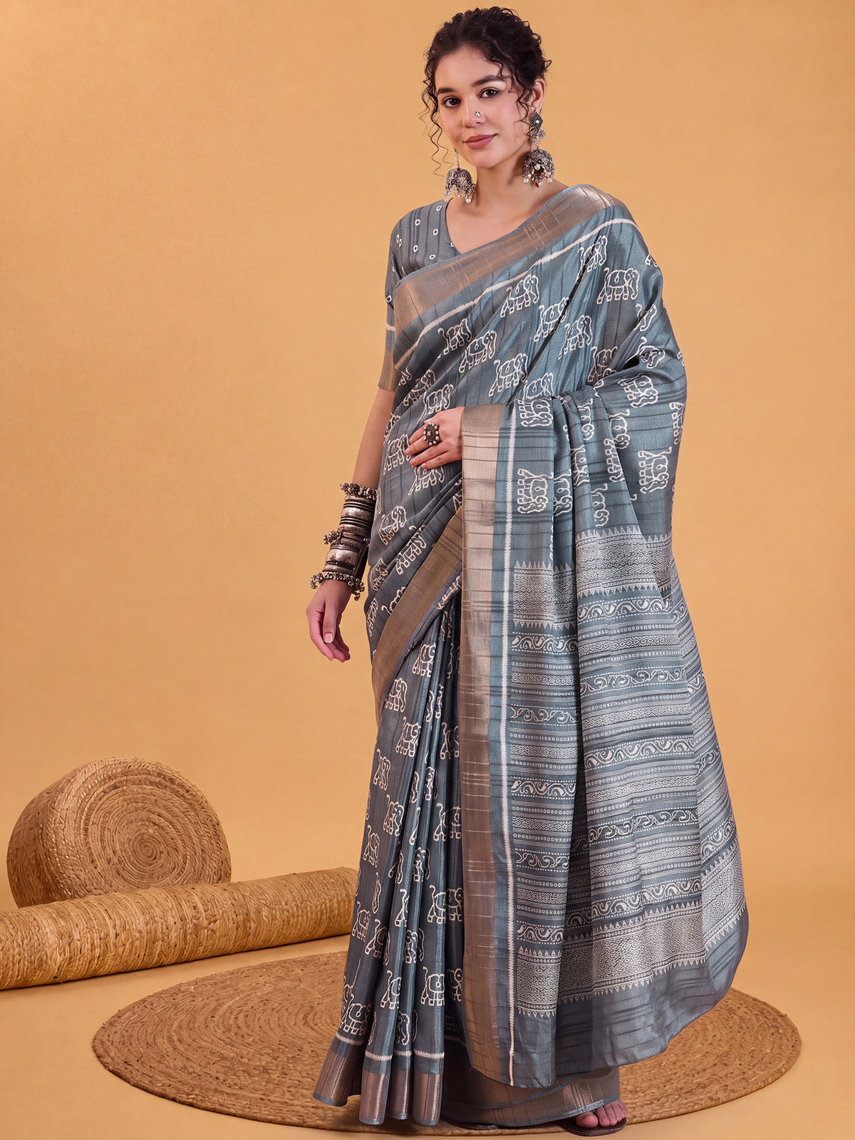 Woman wearing sea green silk blend saree with hand block-printed motifs and sea green blouse