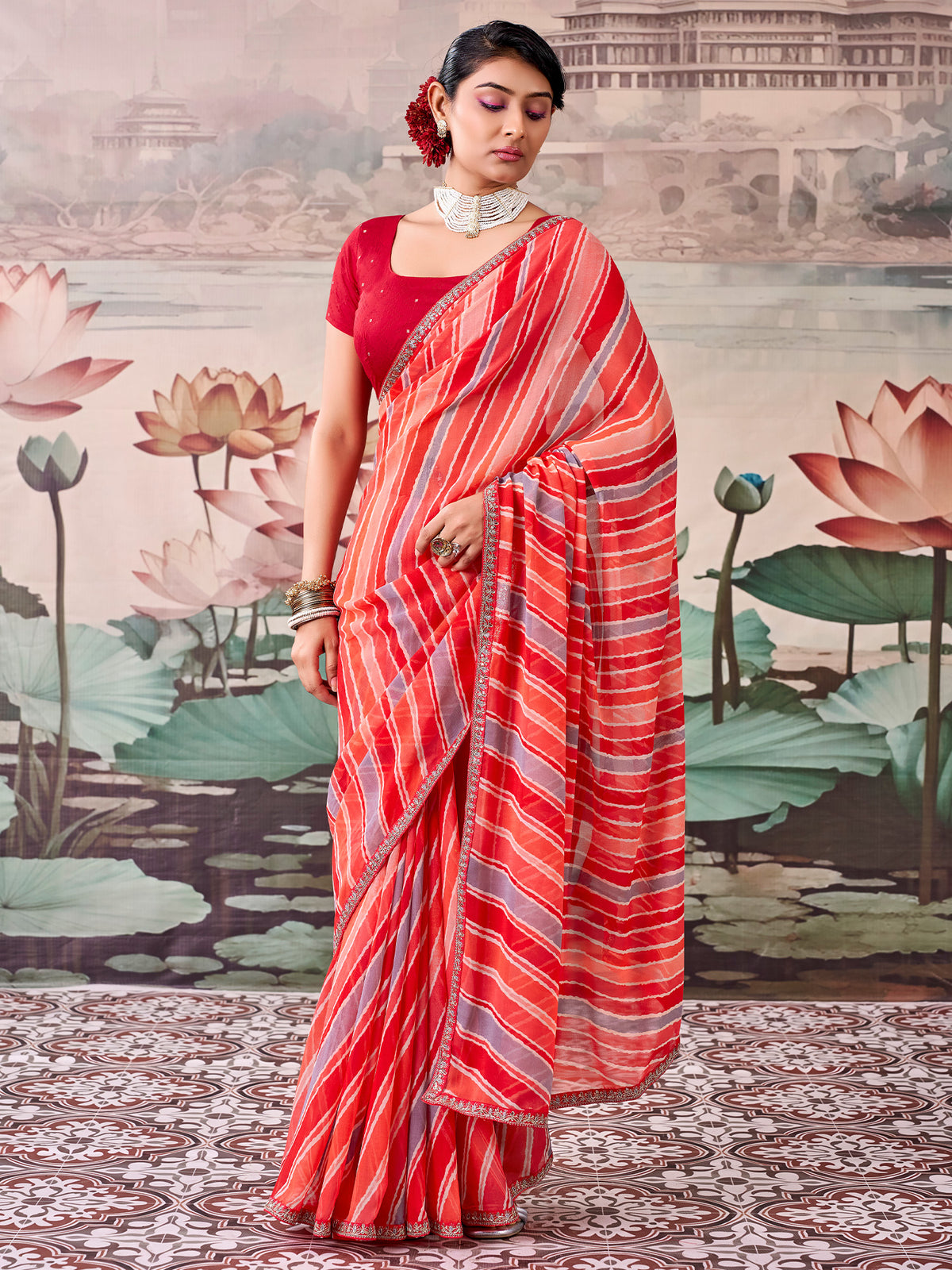 Woman wearing peach georgette saree with leheriya design and red blouse
