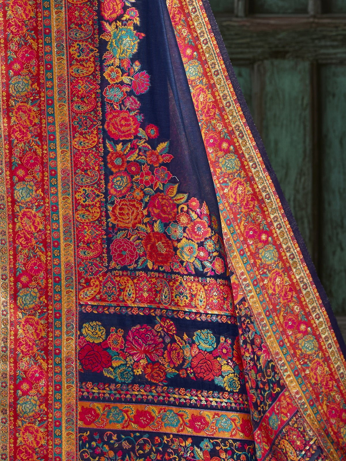 Pallu detail of navy blue cotton saree showing kalamkari narrative motif work and woven design border