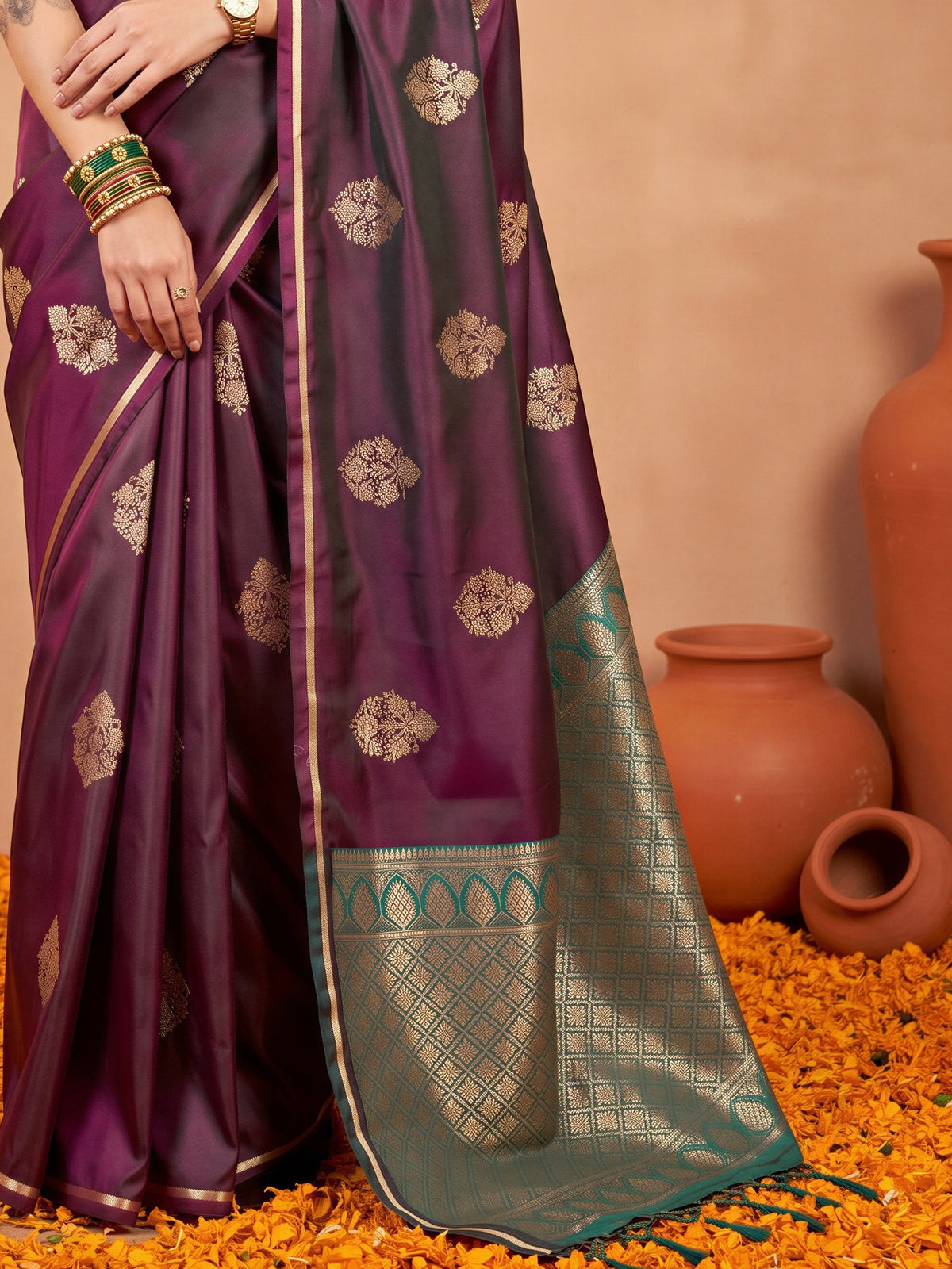 Pallu detail of burgundy satin silk saree showing bagh block-print motif work and zari border
