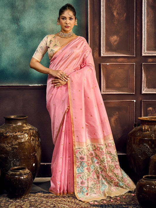Woman wearing pink cotton silk saree with zari butta (metallic motif) work and pink blouse