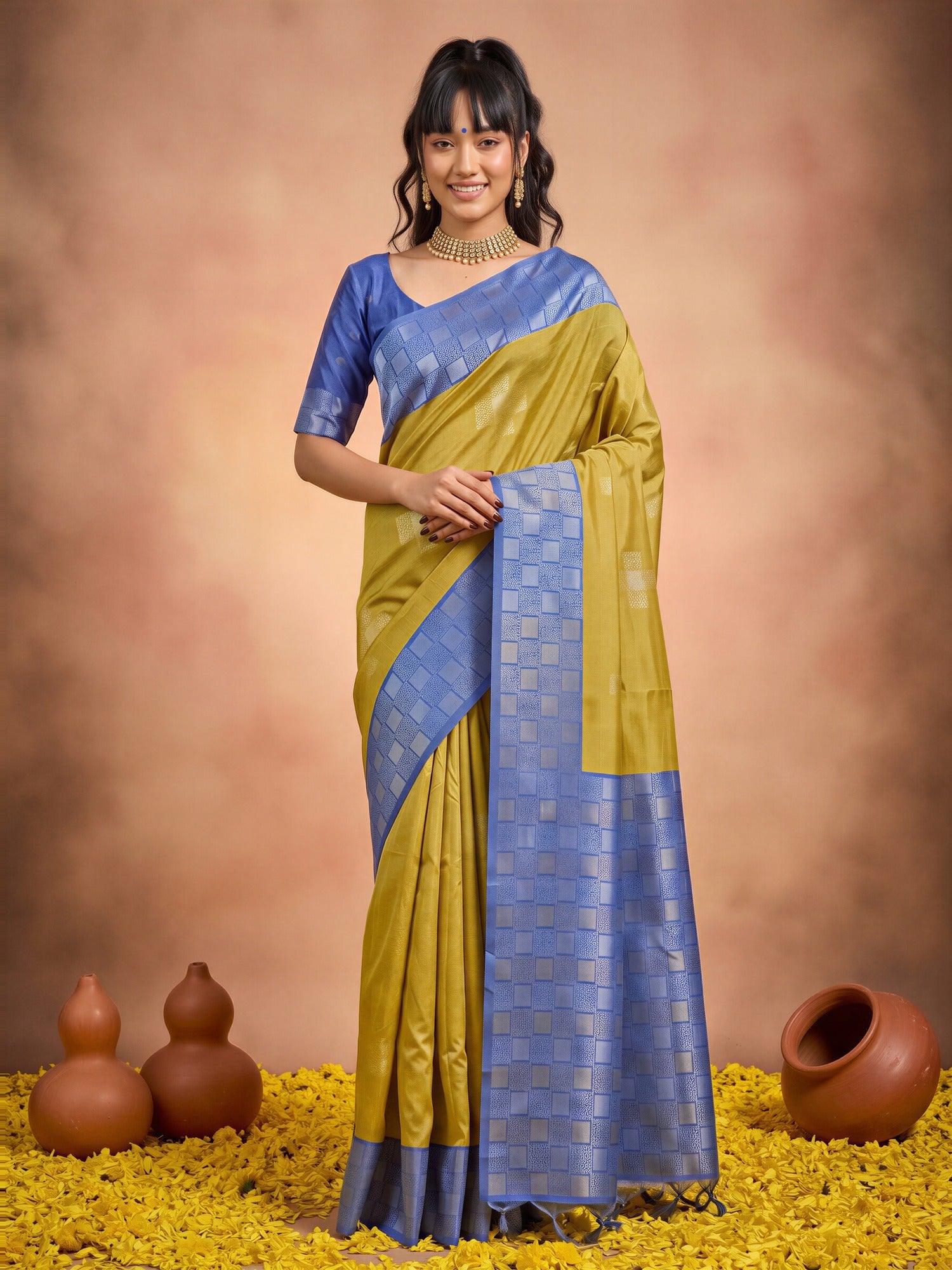 Woman wearing olive cotton blend saree with traditional indian motif work and light blue blouse