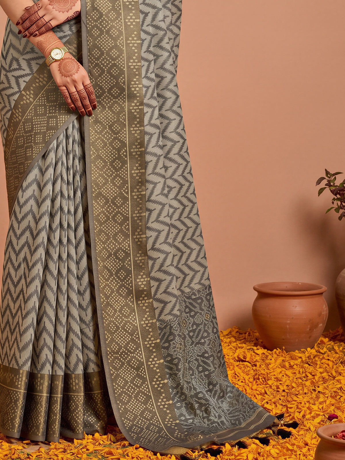 Pallu detail of black viscose saree showing geometric pattern design and zari border