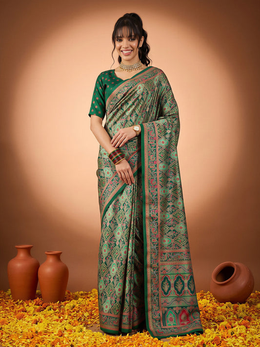 Woman wearing dark green silk blend saree with metallic foil print work and dark green blouse