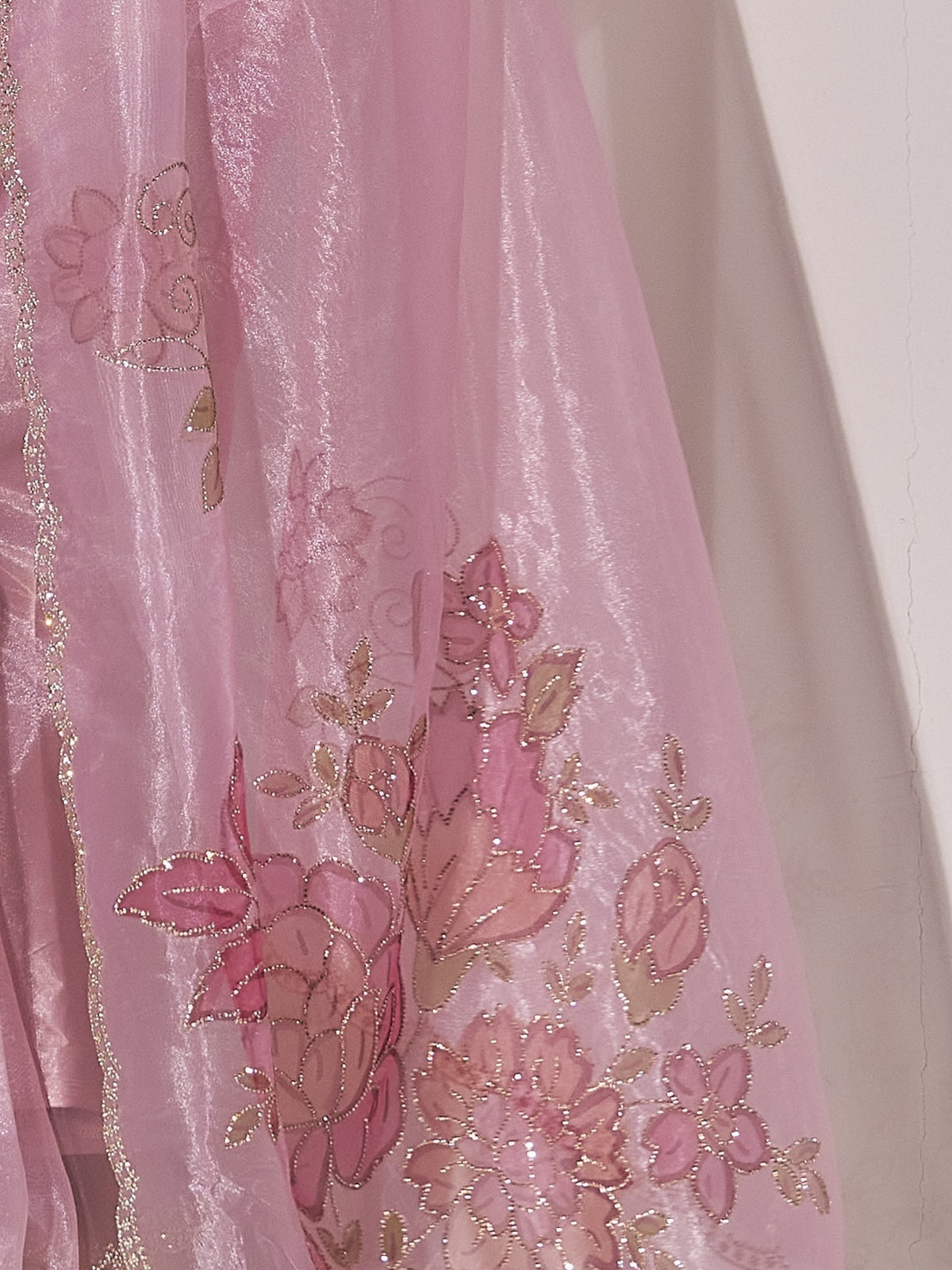 Pallu detail of lavender organza saree showing ornamented surface design and embellished border